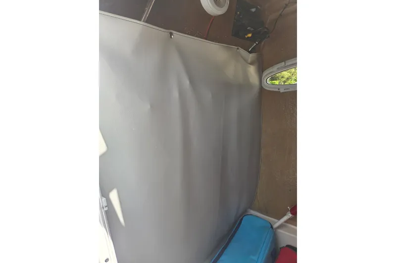 Slide: The Image of Interior view of 2018 Sea Pro 219 Center Console boat with storage area. - 25