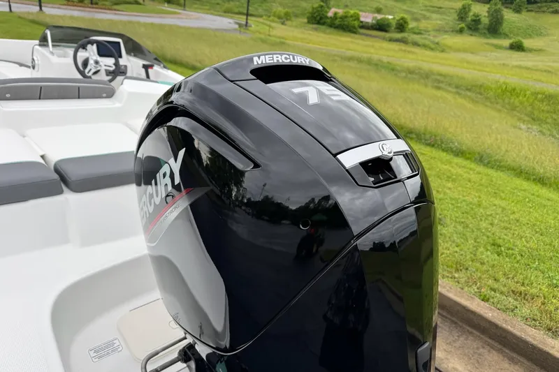 Slide: The Image of 2026 Tahoe T16 boat with Mercury 75 outboard motor in scenic landscape. - 3