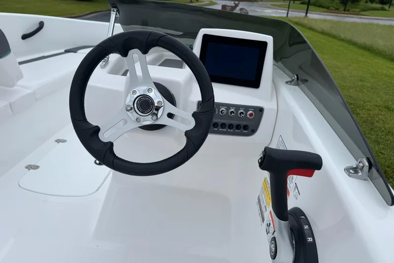 Slide: The Image of Steering console of 2026 Tahoe T16 boat with modern controls and display. - 4