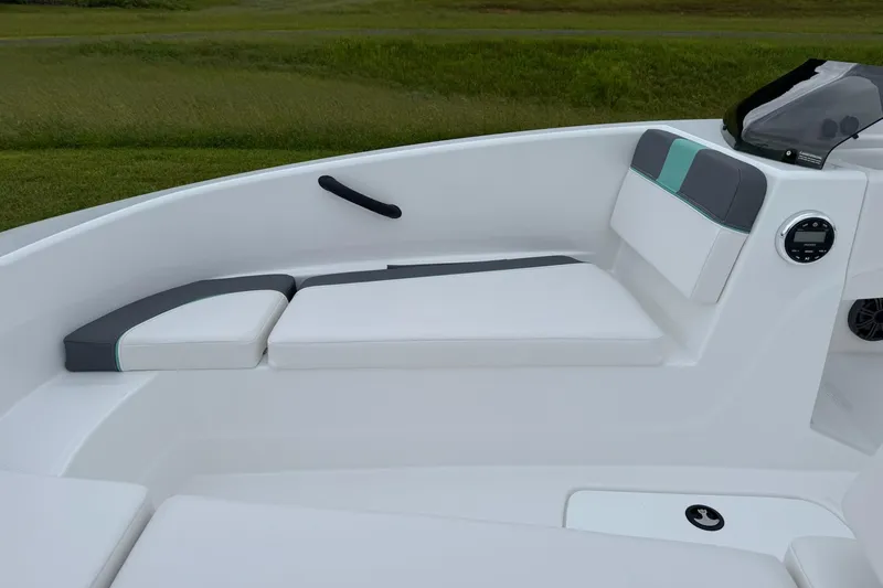 Slide: The Image of 2026 Tahoe T16 boat interior with white and gray cushioned seating. - 5