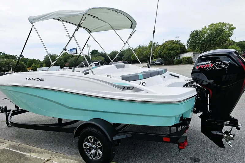 Slide: The Image of 2026 Tahoe T18 boat dashboard with steering wheel and control panel. - 7