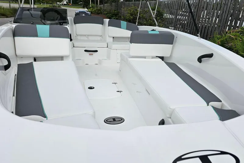 Slide: The Image of 2026 Tahoe T18 boat interior with white and gray seating, teal accents, and modern design. - 9