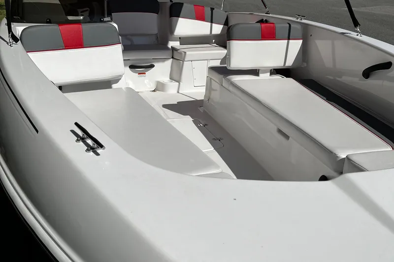 Slide: The Image of 2026 Tahoe T18 boat interior with white and red seating, spacious layout. - 7
