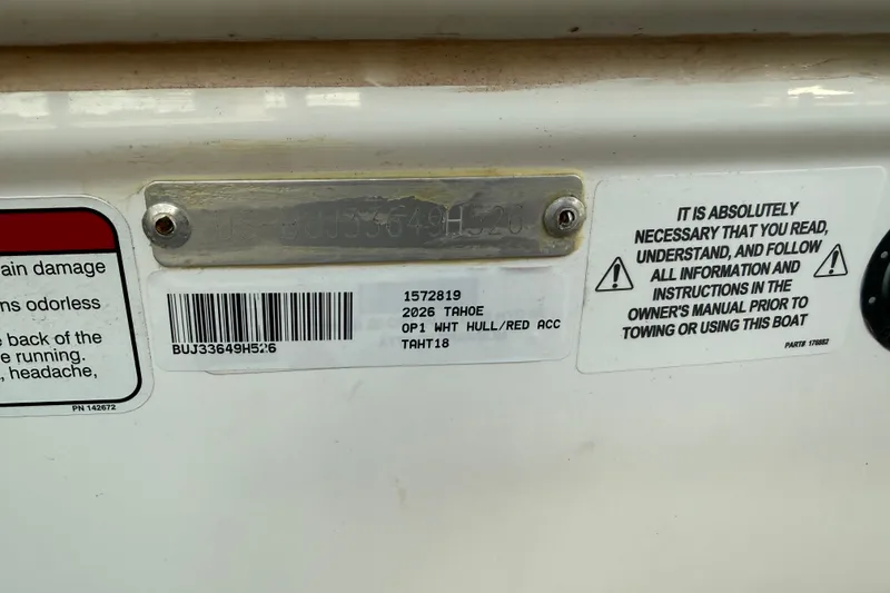 Slide: The Image of 2026 Tahoe T18 boat identification and safety instructions on hull plate. - 13