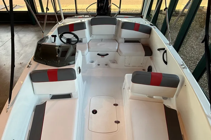 Slide: The Image of 2026 Tahoe T18 boat interior with seating and steering wheel, showcasing modern design. - 6