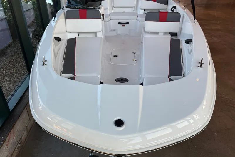 Slide: The Image of 2026 Tahoe T18 boat interior with white and gray seating, red accents. - 11