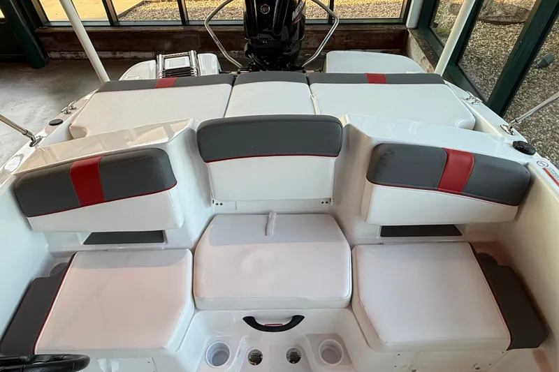 Slide: The Image of 2026 Tahoe T18 boat interior with white and gray seating, featuring red accents. - 7