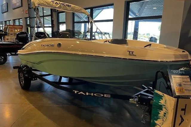 The Image of 2026 Tahoe T16 boat displayed indoors on a trailer. - 0