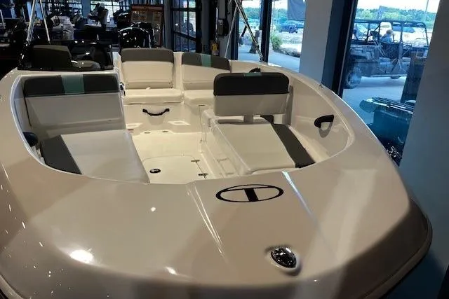 Slide: The Image of 2026 Tahoe T16 boat interior with seating, displayed in a showroom setting. - 4