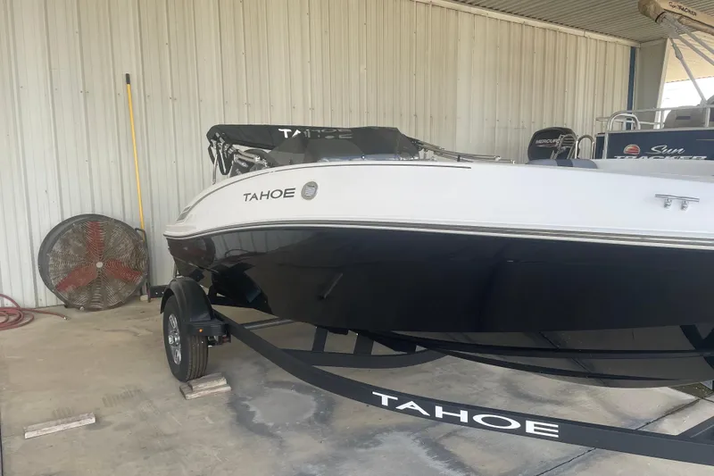 Slide: The Image of 2026 Tahoe T16 boat on trailer in covered storage area. - 5