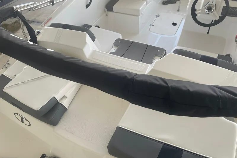 Slide: The Image of 2026 Tahoe T16 boat interior with seating and steering wheel. - 6