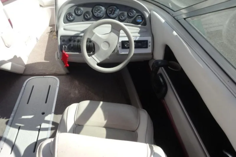 Slide: The Image of Interior of a 1995 Caravelle 206 boat with steering wheel and dashboard controls. - 3
