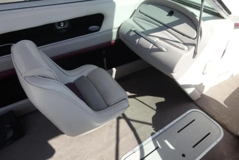 Slide: The Image of Interior of a 1995 Caravelle 206 boat with white seating and storage compartments. - 4
