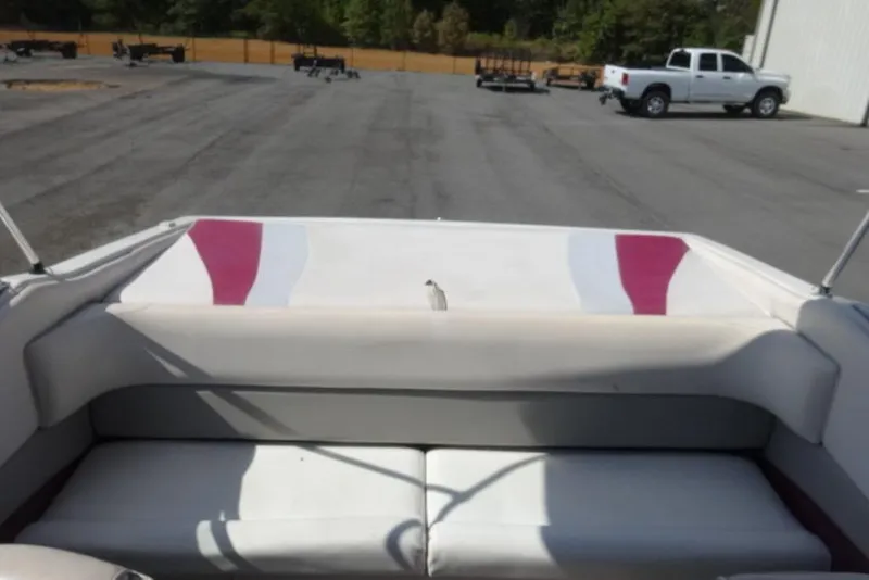 Slide: The Image of Interior of a 1995 Caravelle 206 boat with white and red seating. - 8