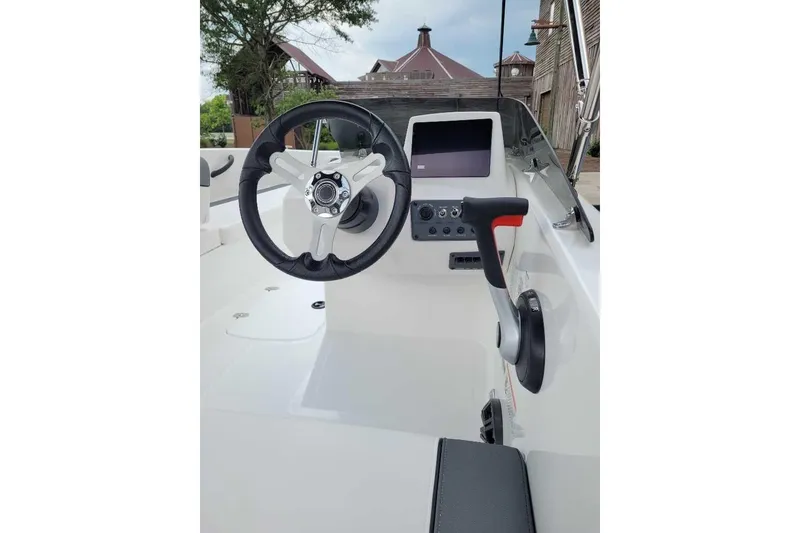 Slide: The Image of 2026 Tahoe T18 boat cockpit with steering wheel and control panel. - 3