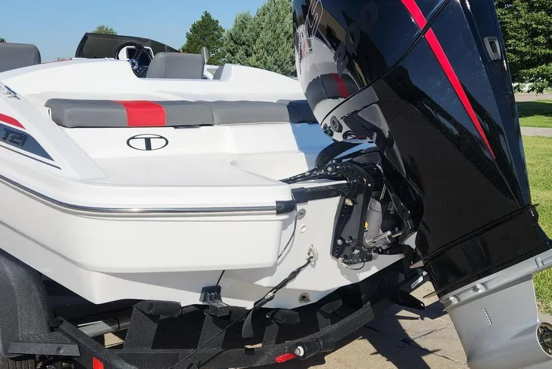 Slide: The Image of 2026 Tahoe T21 boat with powerful outboard motor, sleek design, and modern seating. - 2