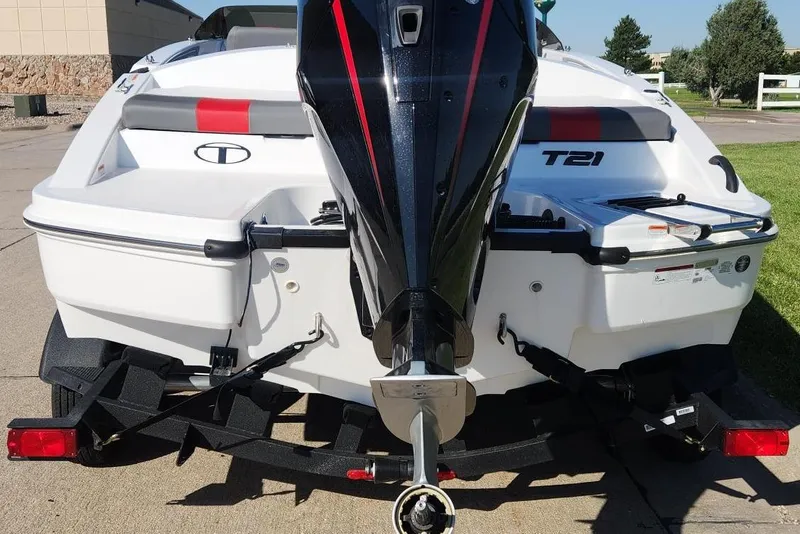 Slide: The Image of 2026 Tahoe T21 boat rear view with outboard motor on trailer. - 3