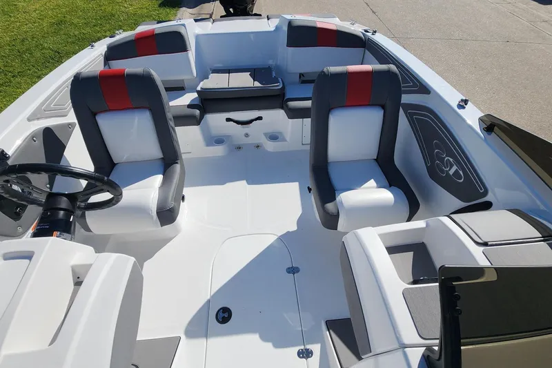 Slide: The Image of 2026 Tahoe T21 boat interior with modern seating and steering wheel design. - 7