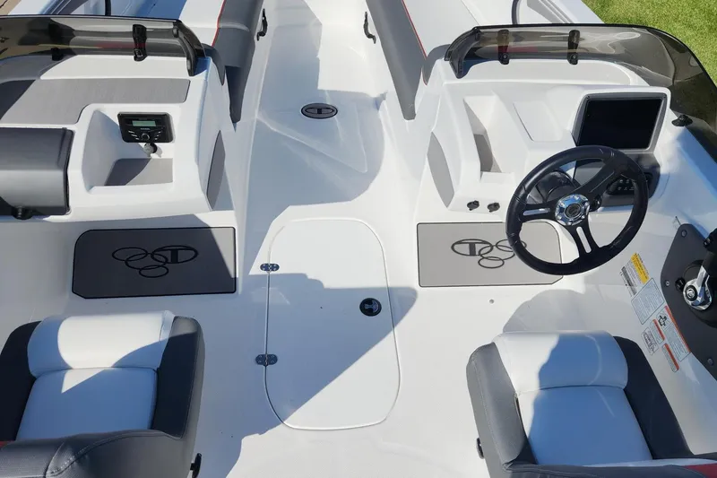 Slide: The Image of 2026 Tahoe T21 boat interior with steering wheel and seating, featuring modern design elements. - 9