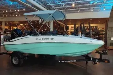 The Image of 2026 Tahoe T16 boat with canopy on display in showroom. - 0
