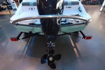 Slide: The Image of 2026 Tahoe T16 boat rear view with motor and propeller in showroom. - 64