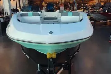 Slide: The Image of 2026 Tahoe T16 boat displayed in a showroom, front view. - 67