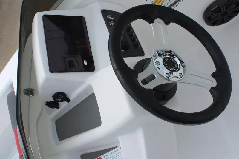 Slide: The Image of Steering console of 2026 Tahoe T16 boat with modern controls and tablet holder. - 11