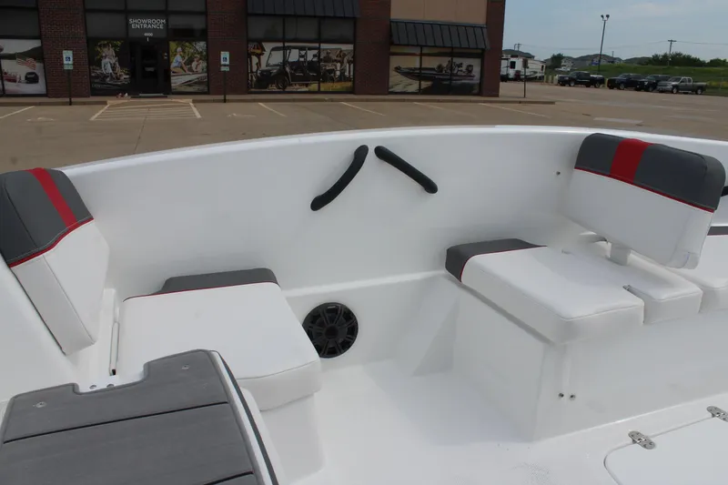 Slide: The Image of 2026 Tahoe T16 boat interior with white and gray seating, red accents, and speaker. - 12