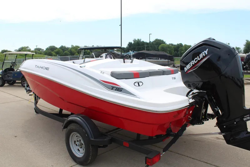 Slide: The Image of 2026 Tahoe T16 boat with Mercury engine on trailer, red and white design. - 5