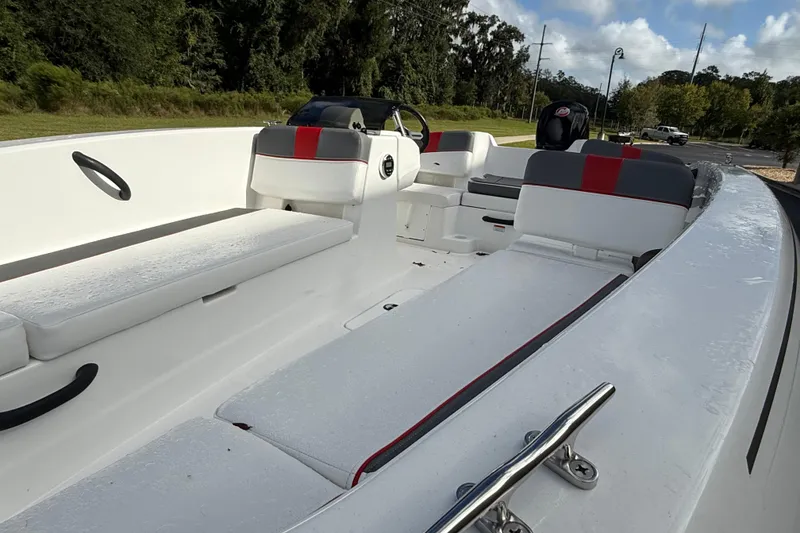 Slide: The Image of 2026 Tahoe T18 boat interior with white and gray seating, outdoor setting. - 3