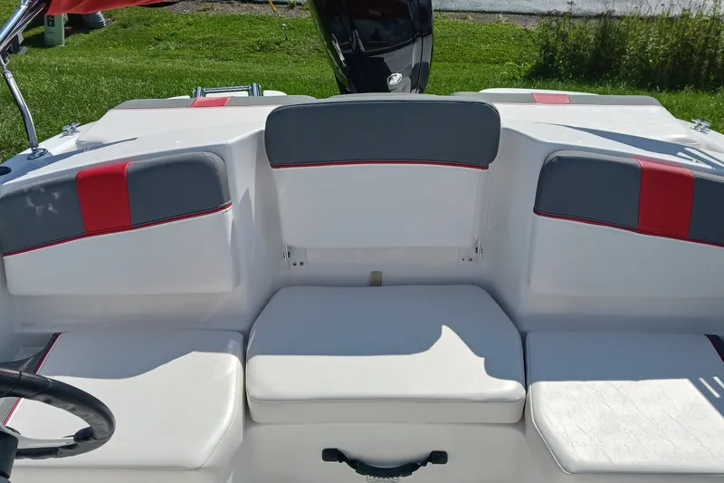 Slide: The Image of 2026 Tahoe T16 boat interior with white and gray seating, featuring red accents. - 8