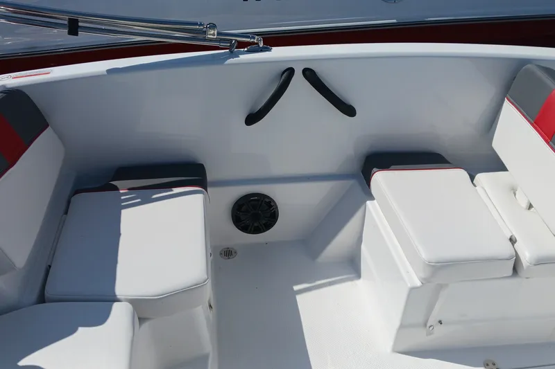 Slide: The Image of Interior seating of 2026 Tahoe T16 boat with white cushions and red accents. - 9