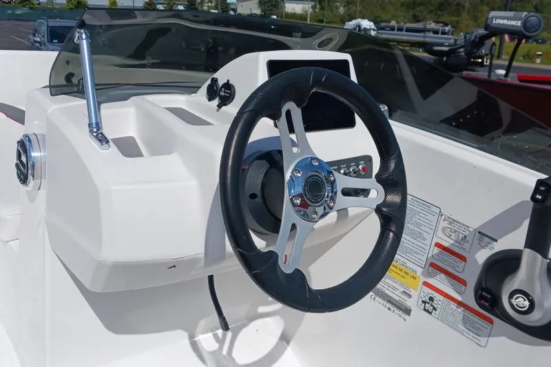 Slide: The Image of Steering console of a 2026 Tahoe T16 boat, featuring modern controls and sleek design. - 5