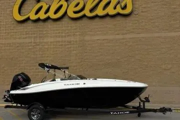 The Image of 2026 Tahoe T18 boat on trailer outside Cabela's store. - 0