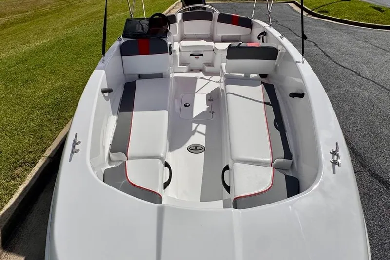 Slide: The Image of 2026 Tahoe T18 boat interior with white and gray seating, red accents, and spacious layout. - 7