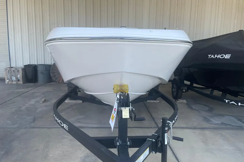 Slide: The Image of 2026 Tahoe T18 boat on trailer in storage facility. - 1