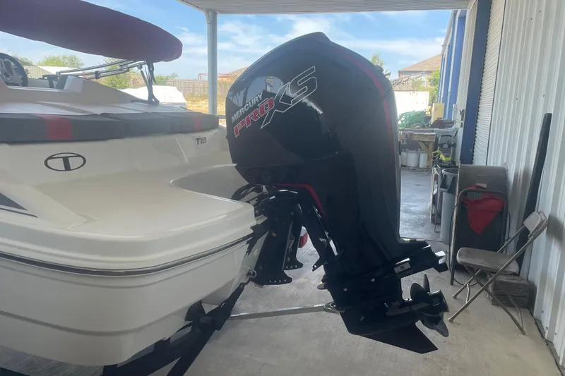 Slide: The Image of 2026 Tahoe T18 boat with Mercury Pro XS outboard motor in a garage. - 4