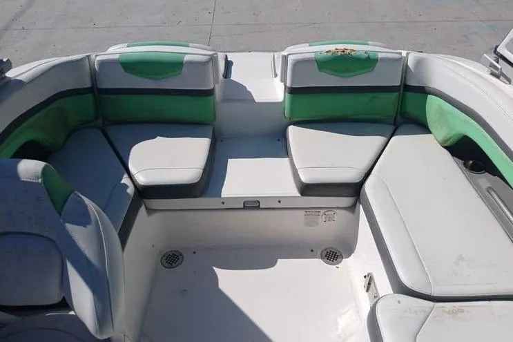 Slide: The Image of 2016 Chaparral Vortex 203 VR boat interior with green and white seating. - 13