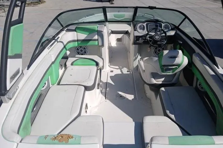 Slide: The Image of 2016 Chaparral Vortex 203 VR boat interior with green and white seating. - 9