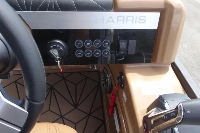 Slide: The Image of 2026 Harris Grand Mariner 250 dashboard with steering wheel and control panel. - 10