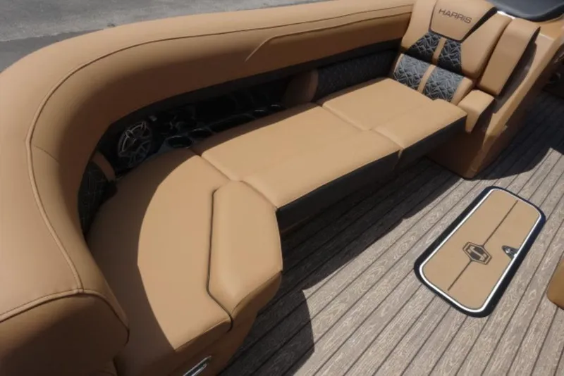 Slide: The Image of Luxurious seating on 2026 Harris Grand Mariner 250 boat, featuring tan upholstery and stylish design. - 11