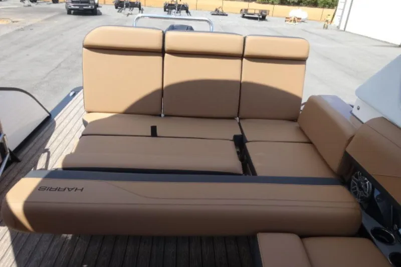 Slide: The Image of 2026 Harris Grand Mariner 250 boat with tan leather seating on deck. - 13