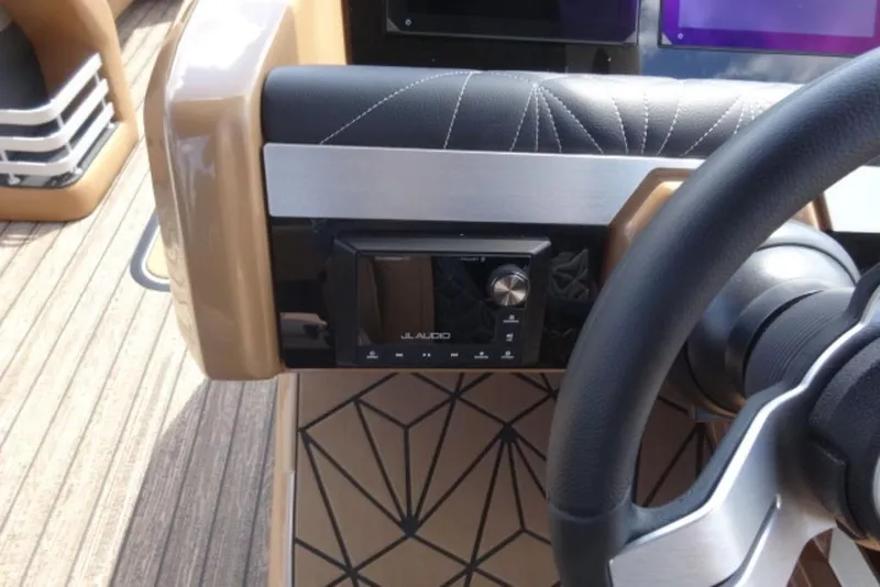 Slide: The Image of Steering console of 2026 Harris Grand Mariner 250 with JL Audio system. - 4