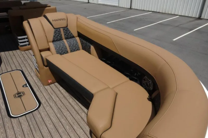 Slide: The Image of Luxurious seating on 2026 Harris Grand Mariner 250 pontoon boat, featuring tan and black upholstery. - 6