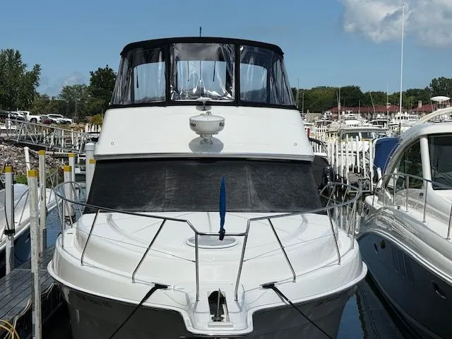 The Image of 2004 Silverton 34 Convertible yacht docked at marina, front view. - 0