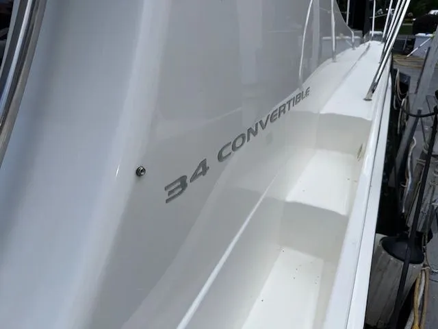 Slide: The Image of 2004 Silverton 34 Convertible yacht side view with model name visible. - 2