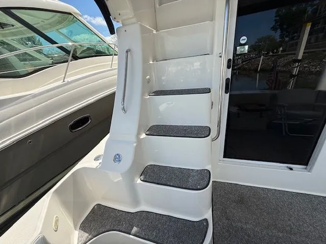 Slide: The Image of 2004 Silverton 34 Convertible yacht stairs with non-slip treads and handrail. - 4
