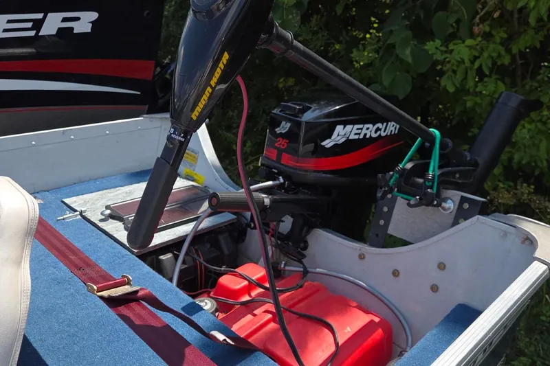 Slide: The Image of 1992 Smoker Craft 142 Magnum boat with Mercury 25 outboard motor and Minn Kota trolling motor. - 3
