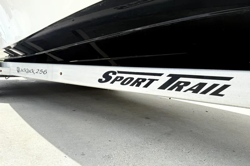 Slide: The Image of 2019 BlackJack 256 boat on Sport Trail trailer, close-up view. - 12