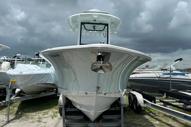 Slide: The Image of 2020 Sea Hunt Ultra 275 SE boat on trailer under cloudy sky. - 3